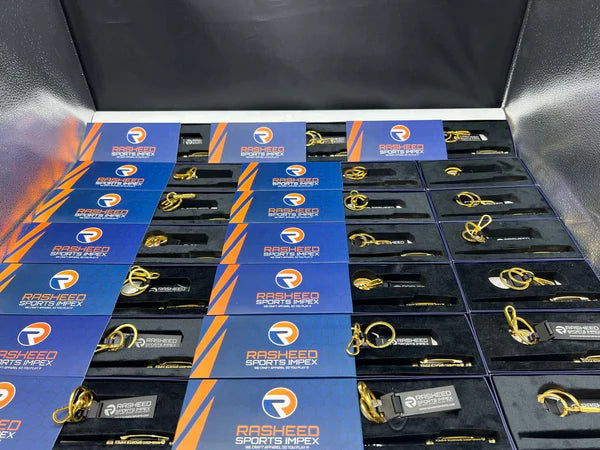 Stack of branded boxes with visible logos on a black background