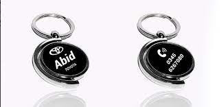 Half moon metal keychain with sleek minimalist design.