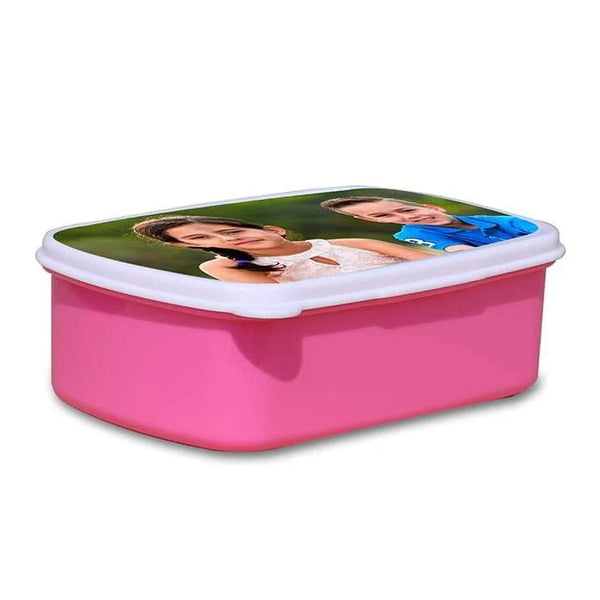 Pink lunch box with a printed lid on a white background